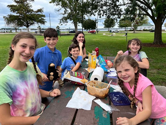 family eating picnic at New Bern waterfront