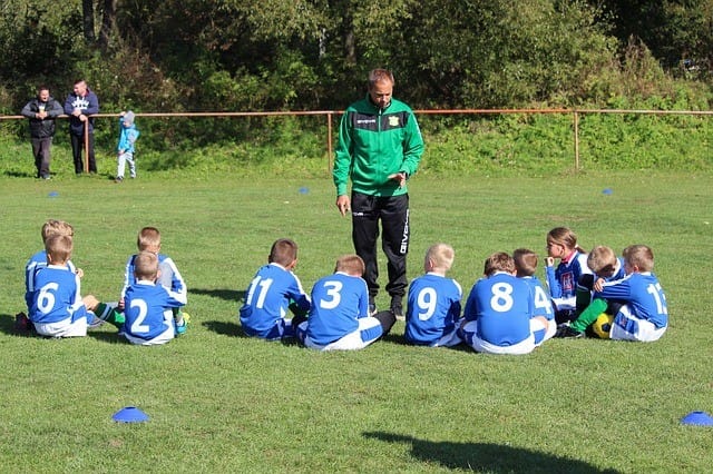 kids sitting at an extracurricular activity