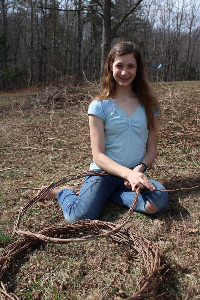 girl weaving wreaths
