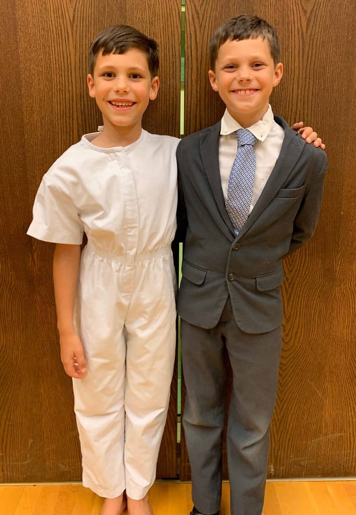 two brothers at a baptism