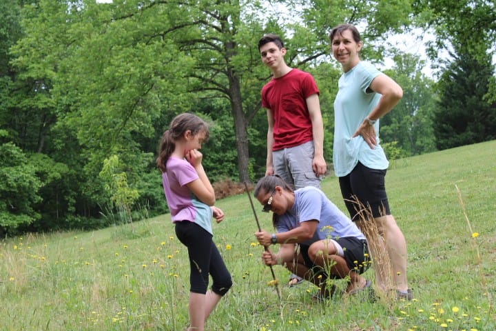 Kids moving an electric fence