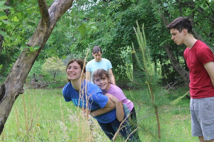 kids goofing off while moving an electric fence
