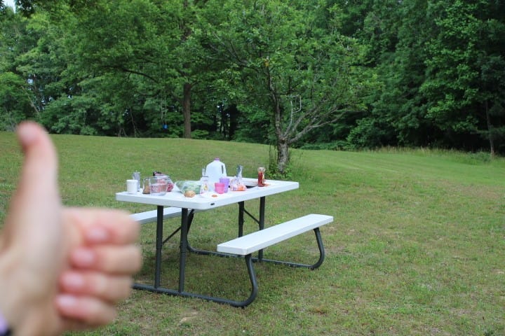 picnic table with dinner on it