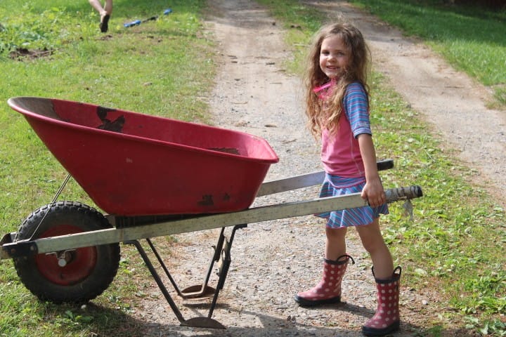 5 year old girl with wheelbarrow