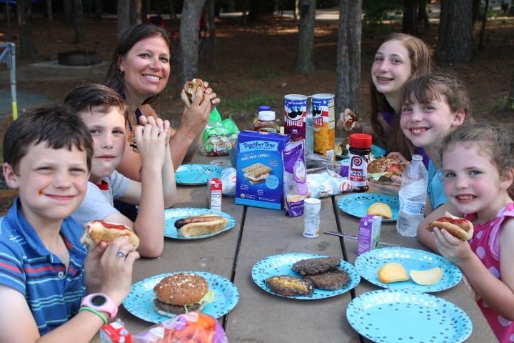 family eating dinner camping
