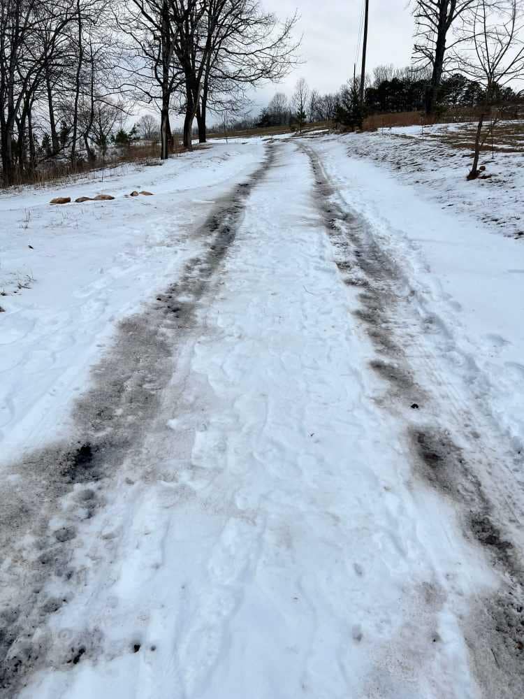 wood ash spread on driveway to melt snow