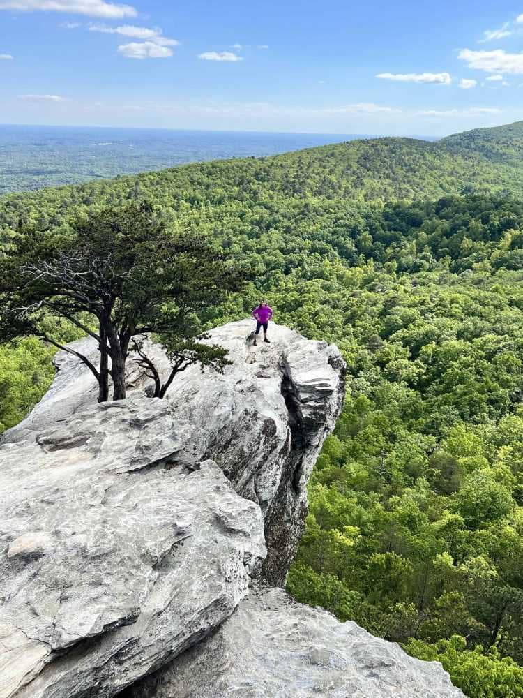 woman on hanging rock