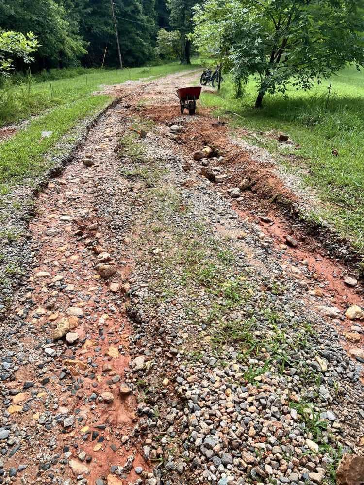 a driveway with huge ruts in it