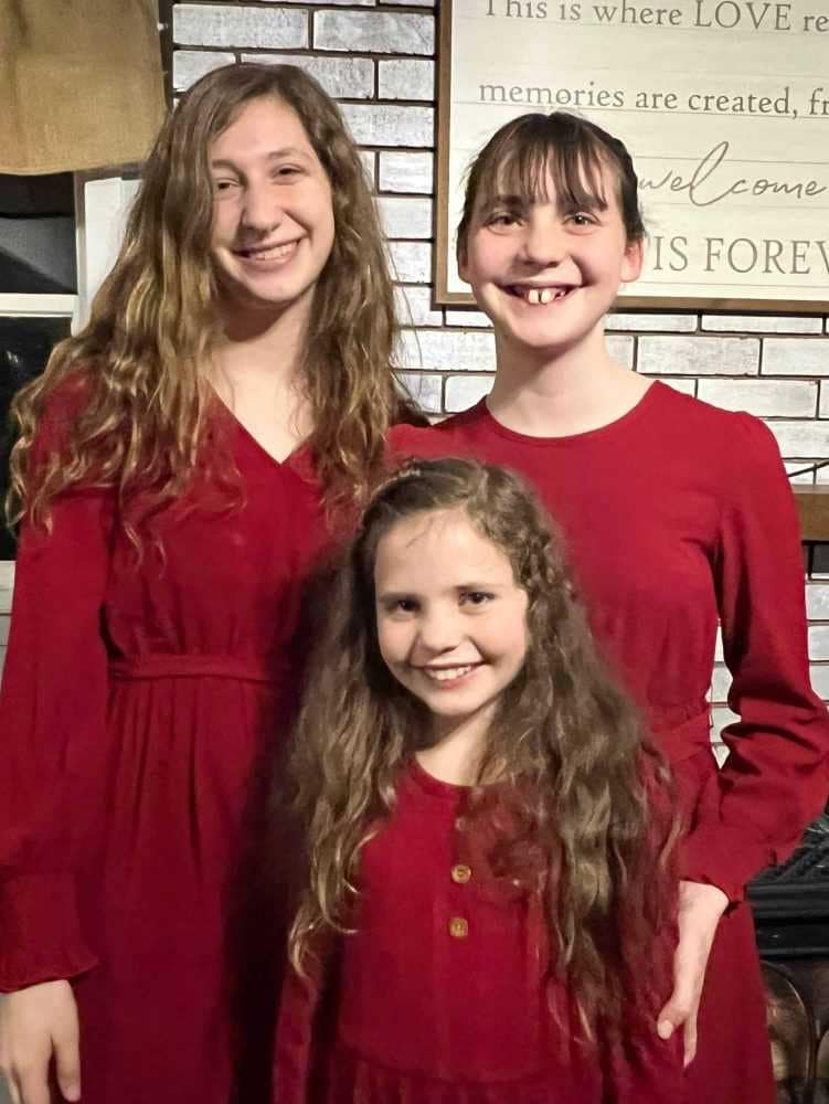 3 girls wearing red valentine dresses