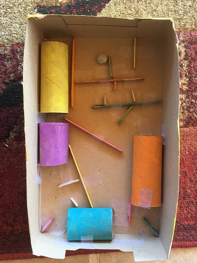 cardboard marble maze made by 10 year old