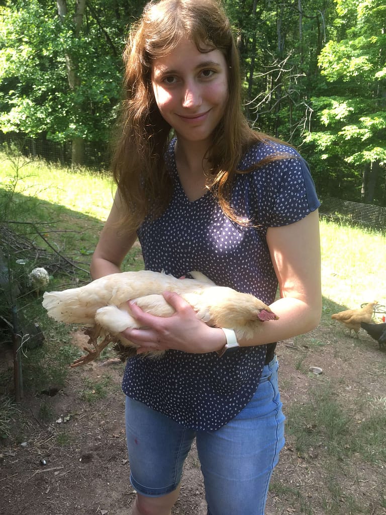 17 year old girl holds dead pet chicken
