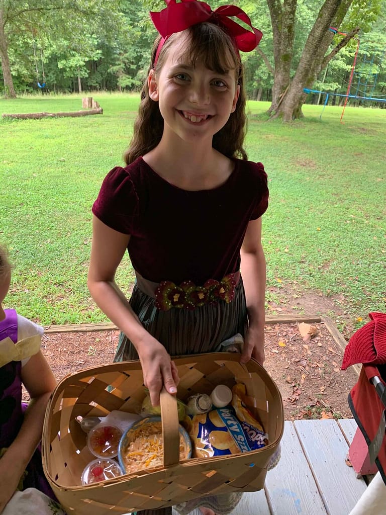 11 year old with basket of food