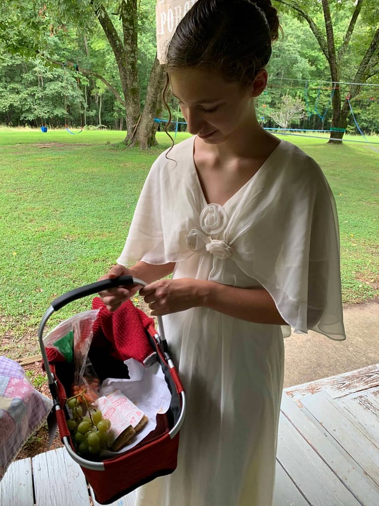 13 year old with a basket of food