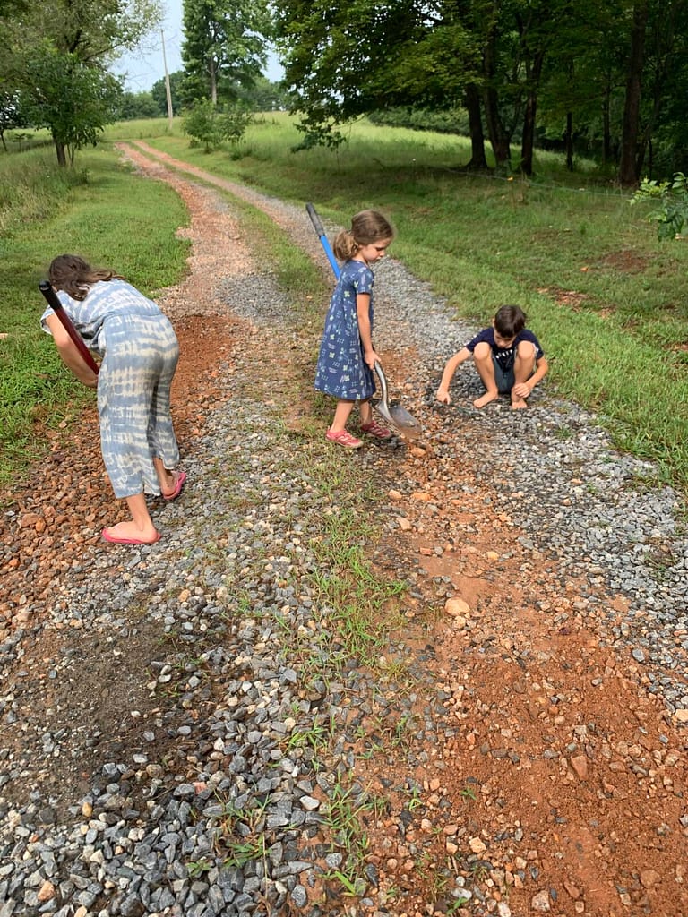 kids repairing the driveway