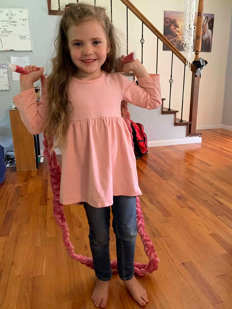6 year old with her finger crocheted jump rope