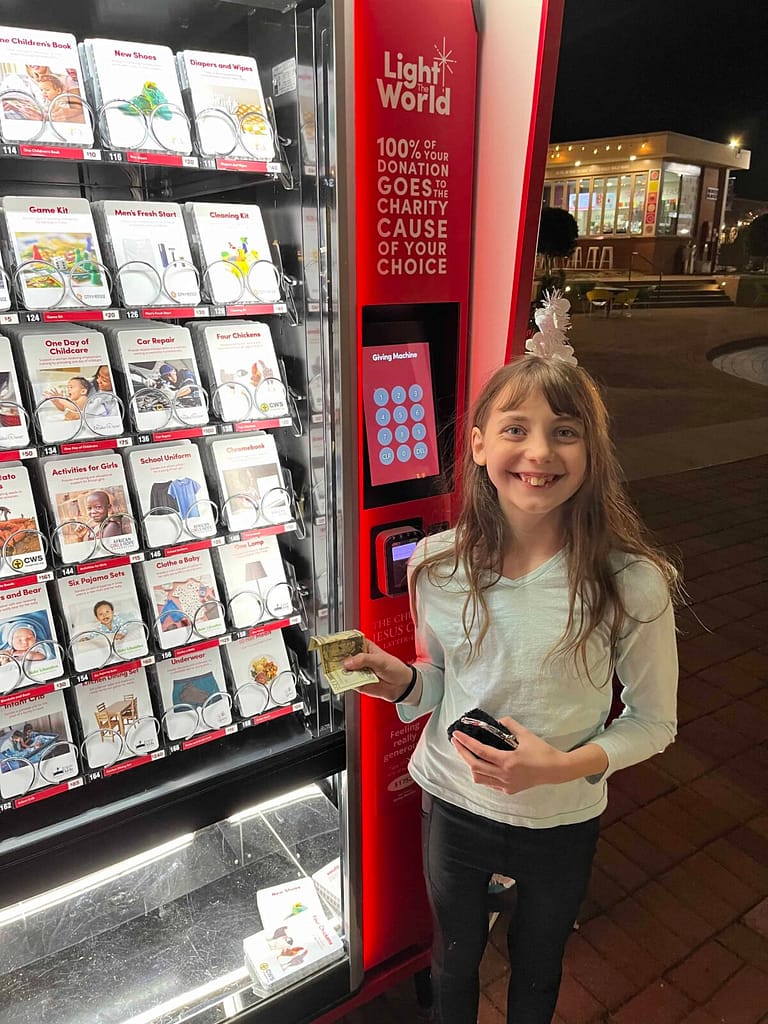 11 year old donating to giving machine