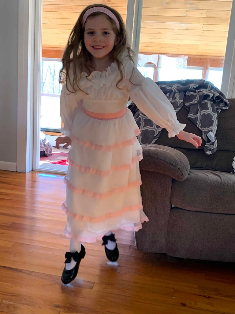 6 year old girl in a little mermaid dress tap dancing