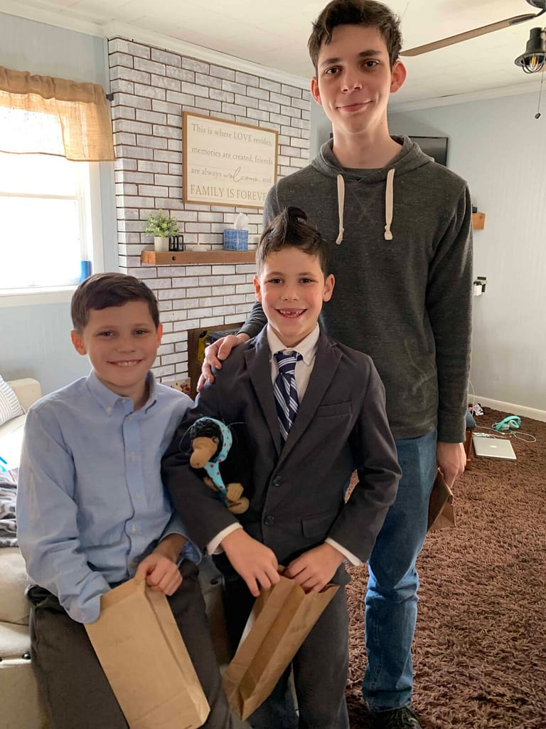 3 boys dressed up doing a calpurnia tate luncheon