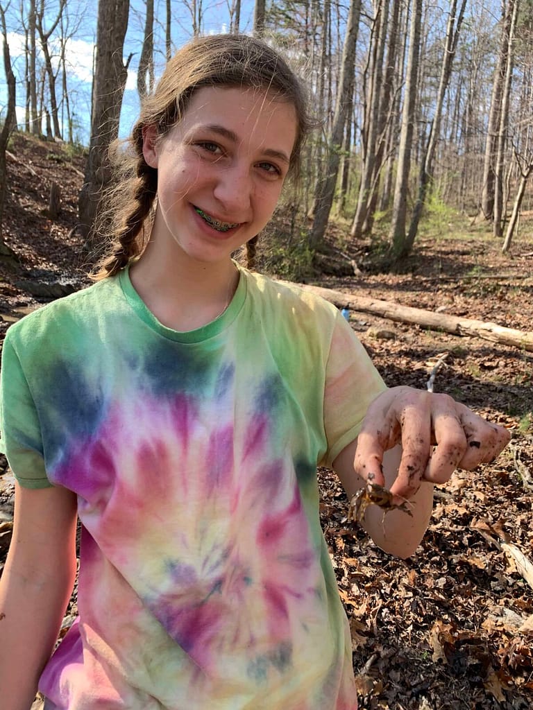 13 year old playing with a crawdad