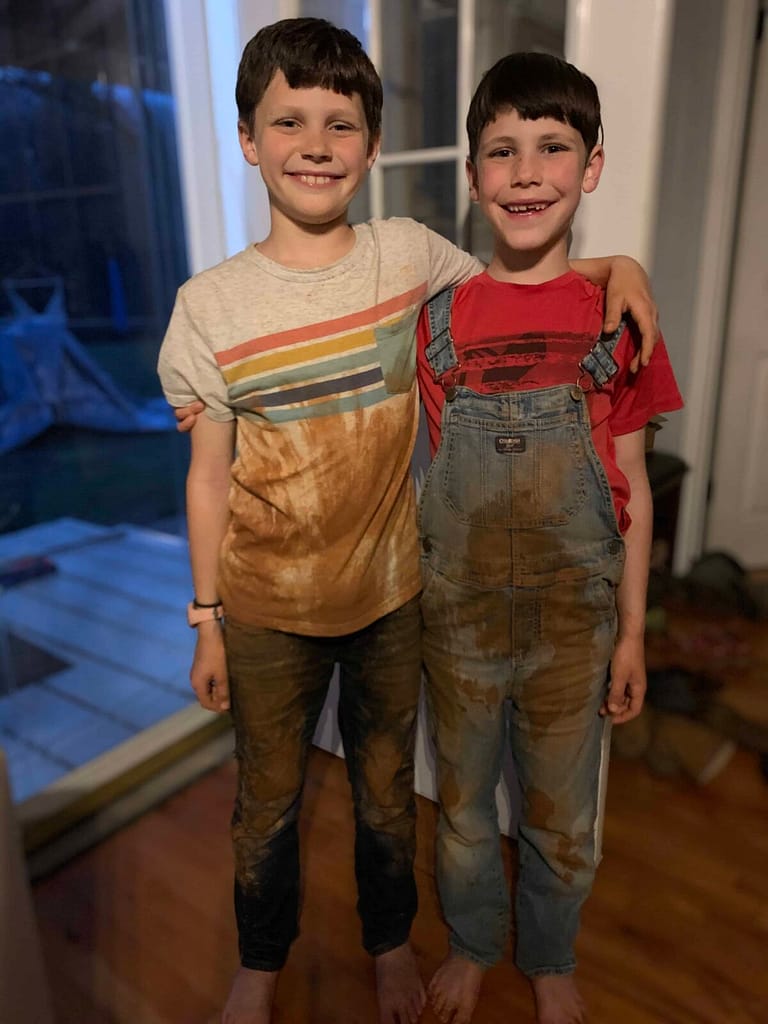 two boys with dirty clothes