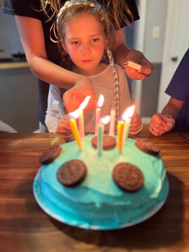 girl lighting candles