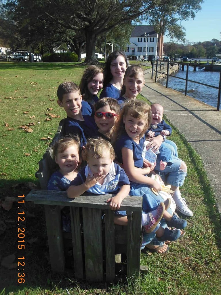 9 kids on a park bench in Edenton