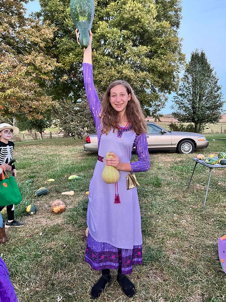 teen girl dressed as Asha from Wish for Halloween