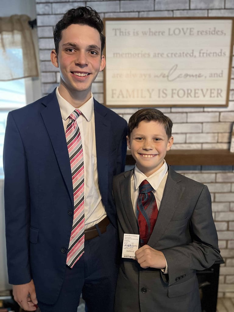17 and 11 year old brothers in suits