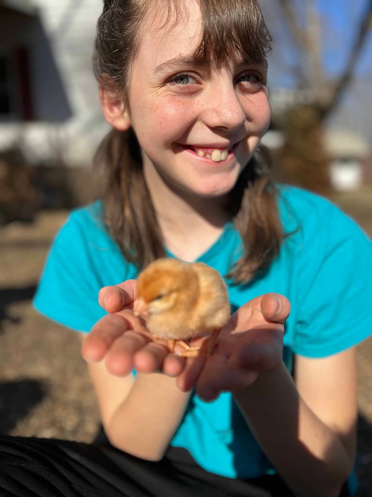 13 year old holding a chick