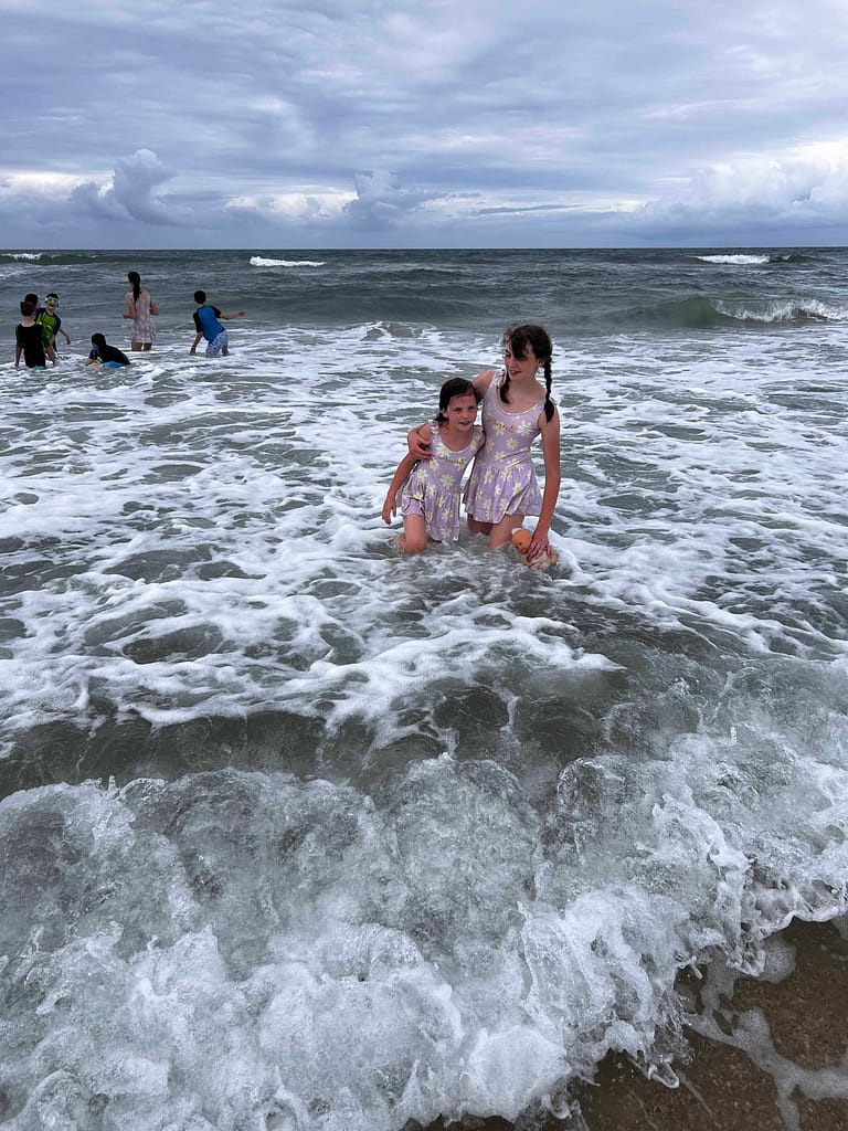 kids playing in the ocean