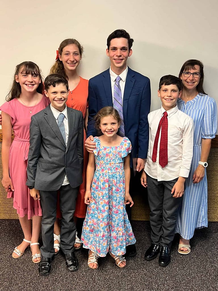 mom and 6 kids dressed in Sunday clothes