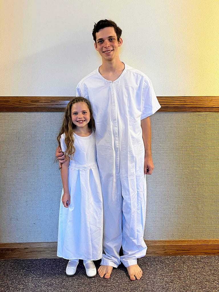 brother baptizing sister