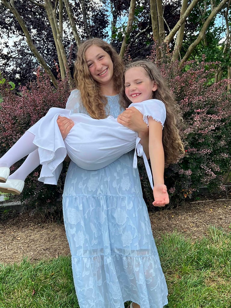 sister holding 8 year old sister