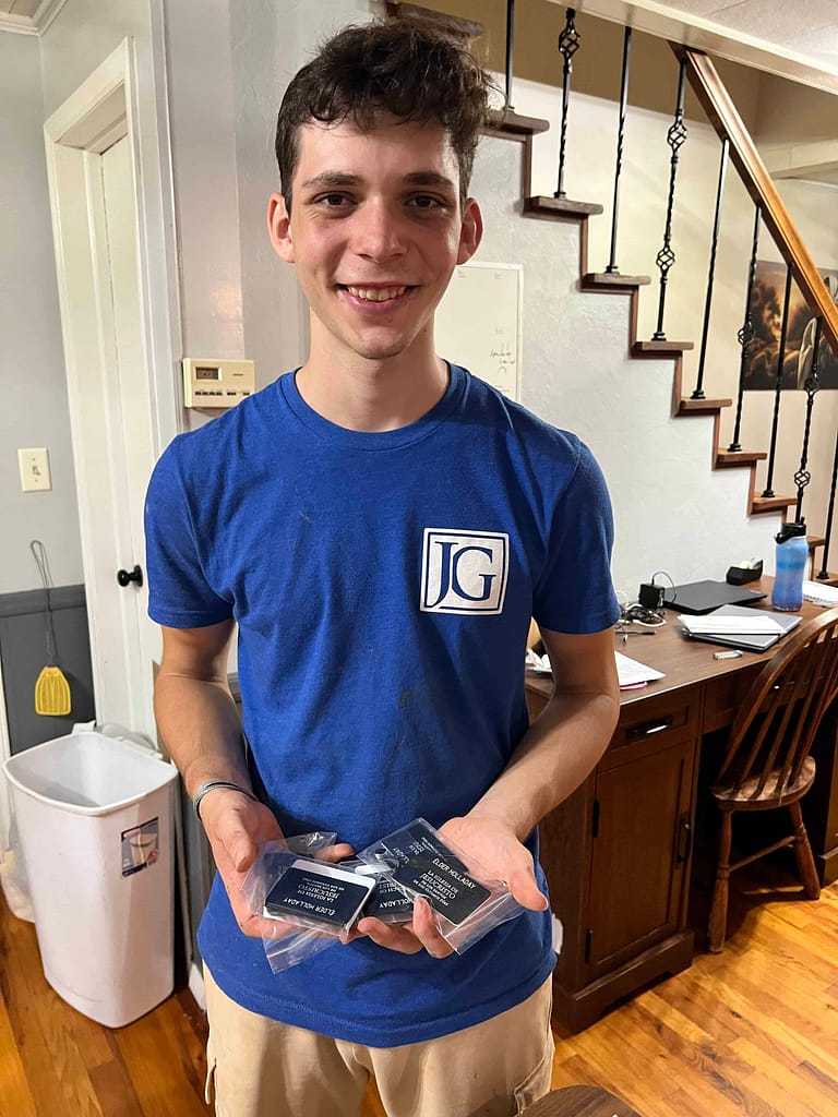 missionary holding new nametags