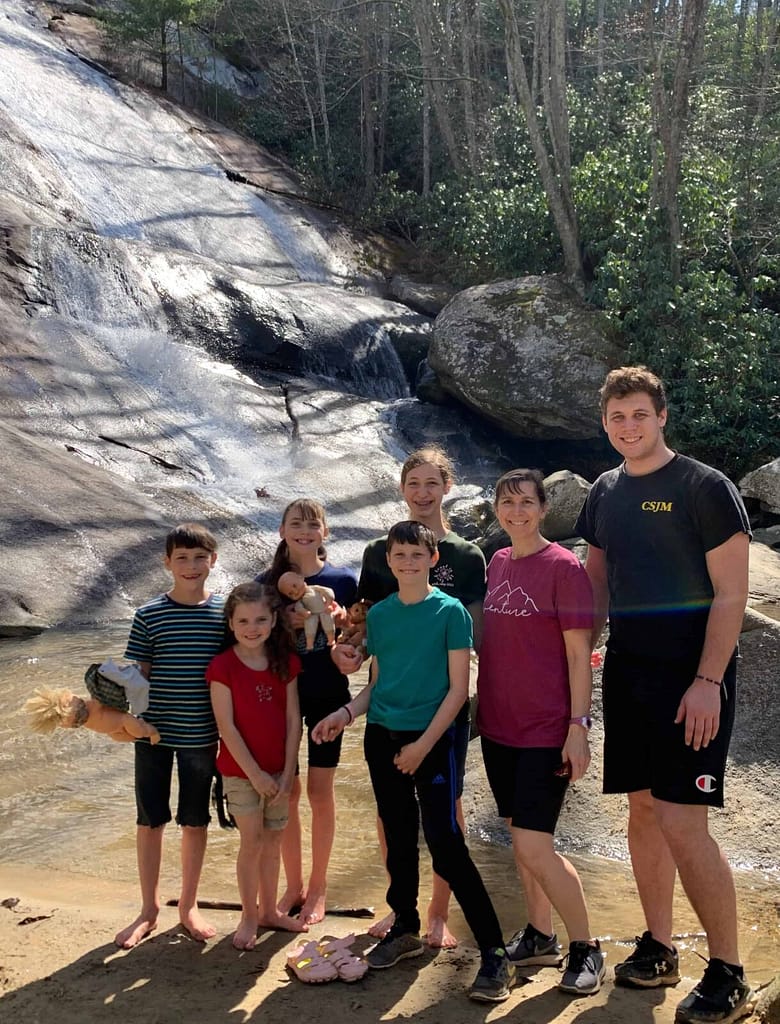 Family of mom and 7 kids at Stone Mountain waterfall, NC