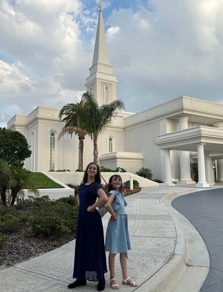 sister posing in front of the Orlando temple