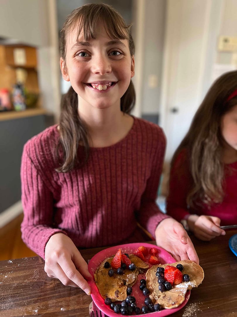 13 year old eating heart shaped pancakes for Valentines Day