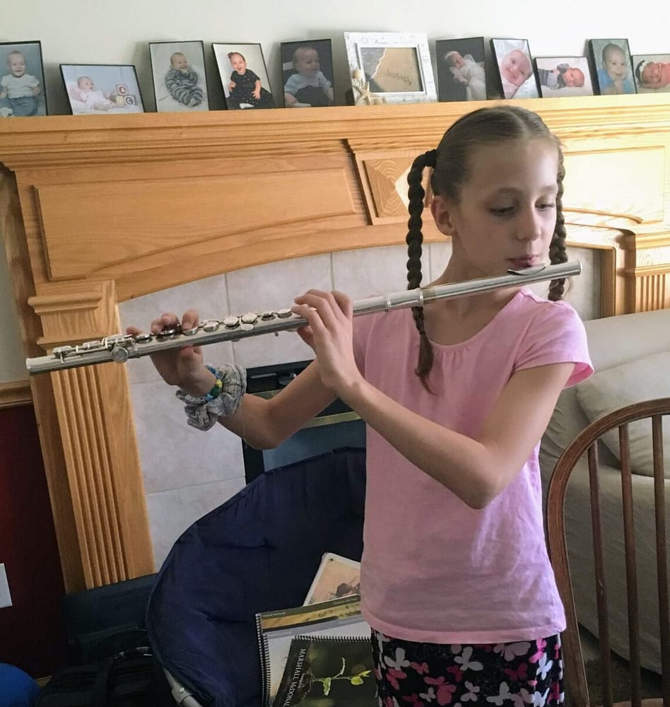Young girl playing the flute