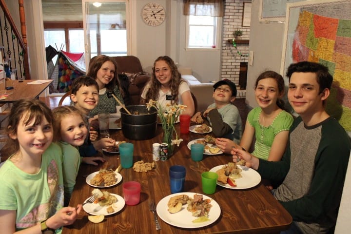 family eating St Patricks Day dinner corned beef and cabbage