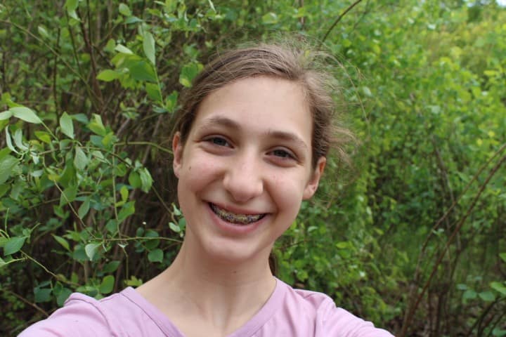 selfie of 13 year old girl while working in a blueberry patch