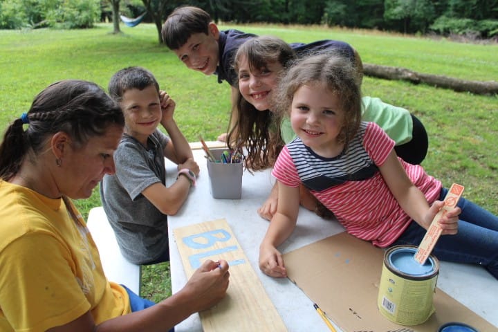 kids paint blueberry signs