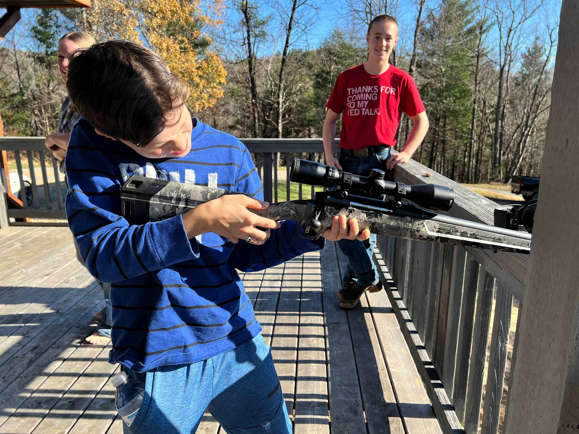 boy learning to shoot a gun