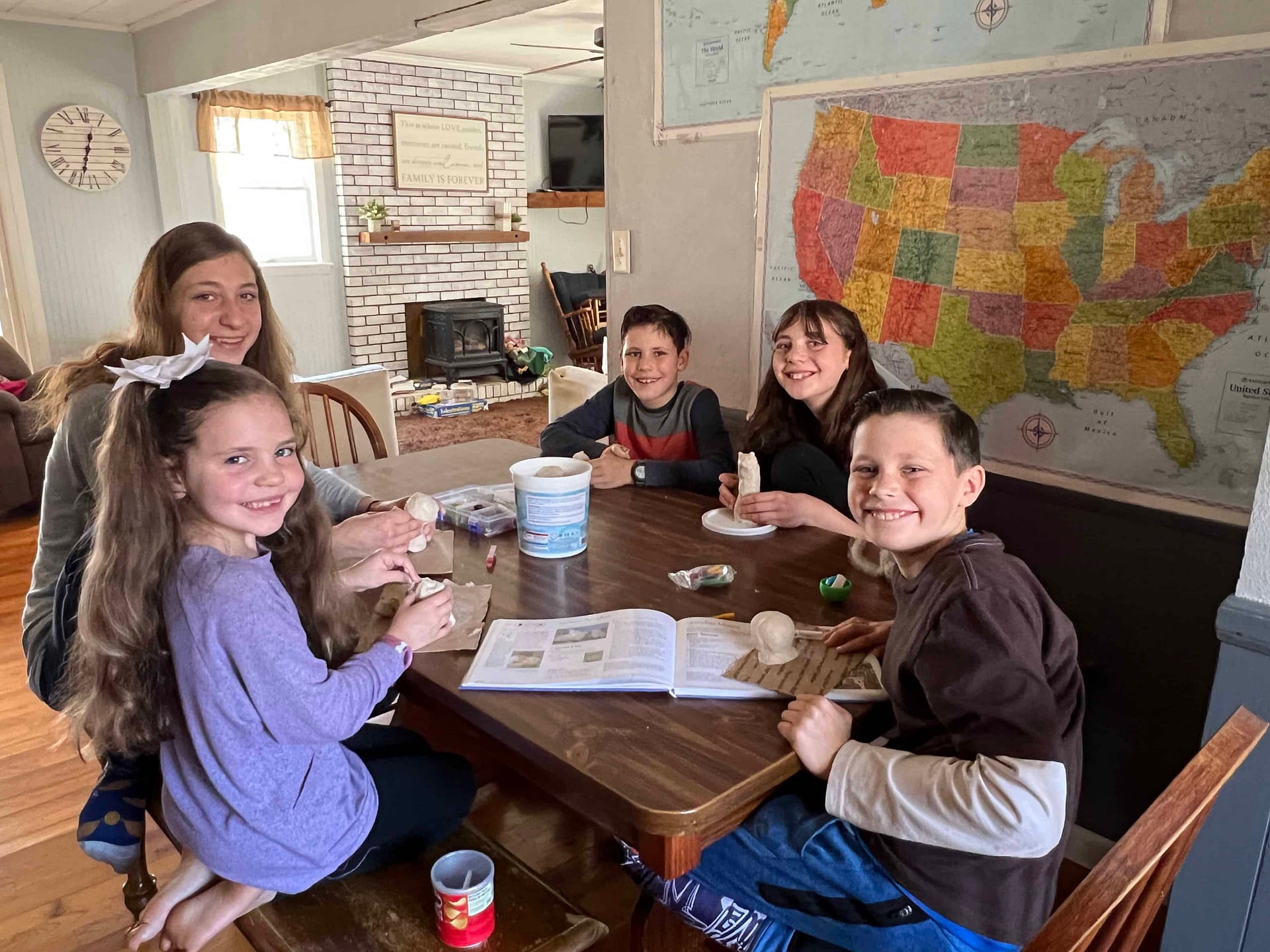 siblings sculpting with air dry clay