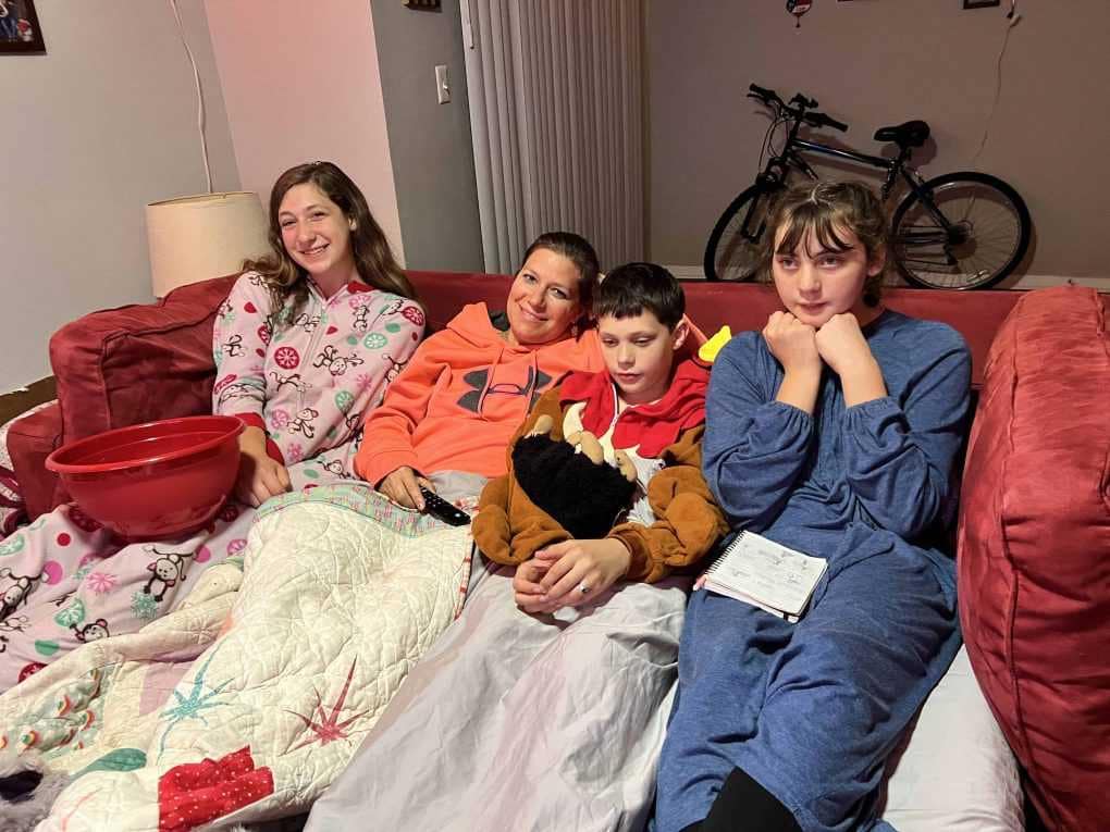 kids and aunt watching a movie