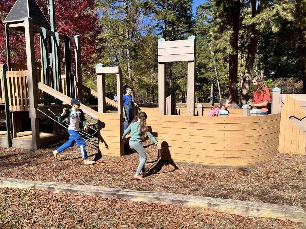 kids playing at a ship playground